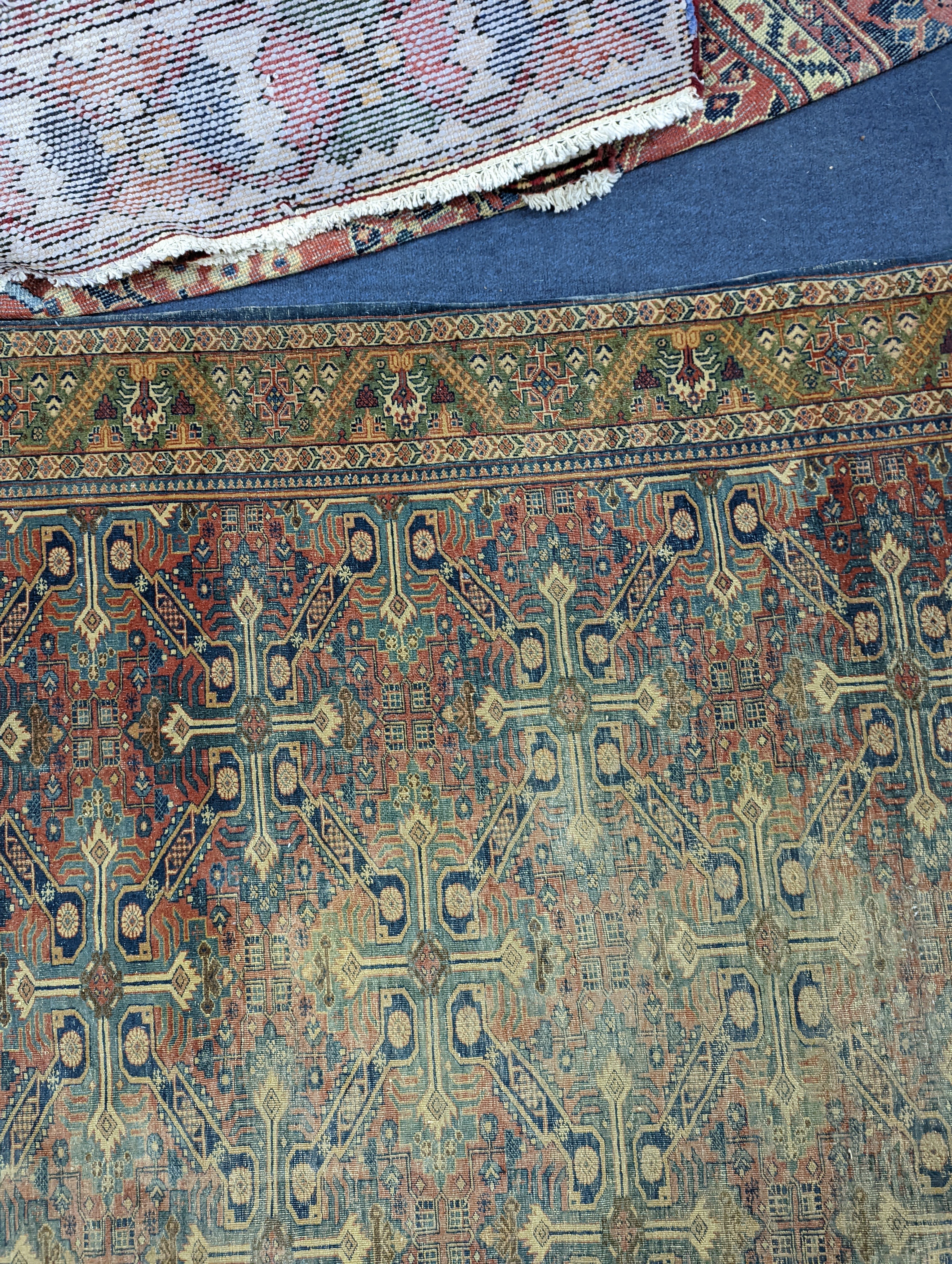 Three antique rugs, Caucasian and North West Persian, largest 230 x 154cm